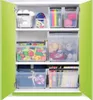 A cabinet filled with various storage containers holding toys, art supplies, and books. Anteprima dell’immagine prodotto