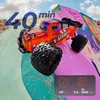 An orange remote-controlled off-road car is positioned on a colorful ramp in a skate park. Anteprima dell’immagine prodotto