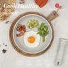A breakfast plate with bacon, avocado, and a fried egg, presented on a wooden board with marketing text and icons. Produktbild-Vorschau