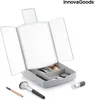 A makeup organizer with a lighted mirror and makeup accessories. Anteprima dell’immagine prodotto