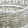 A close-up view of a woven rattan basket. Produktbild-Vorschau