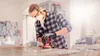 A man is sanding a wooden surface in a workshop. Produktbild-Vorschau