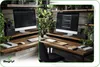 A desk setup with two computers, plants, and desk accessories. Podgląd zdjęcia produktu