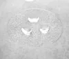 Three water droplets on a textured glass plate. Náhľad obrázku produktu
