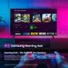 A Samsung Gaming Hub interface displayed on a TV screen, with ambient lighting. Produktbild-Vorschau