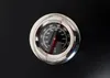 A close-up of a thermometer on a black surface. Produktbild-Vorschau