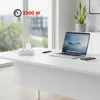 A white power strip with a laptop and phone charger on a white desk in front of a window. Voir les images du produit
