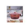 Product packaging for a red casserole dish, with images of food. Produktbild-Vorschau