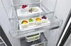 Close-up of the interior of a refrigerator showing drawers and food items. Produktbild-Vorschau