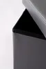 A close-up view of the top corner of an open storage ottoman. Produktbild-Vorschau