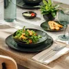 A table setting with a salad and bread, suggesting a meal. Produktbild-Vorschau