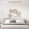 A wall mirror is displayed above a bed, with size dimensions indicated. Produktbild-Vorschau