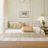 A bedroom scene featuring a beige upholstered daybed with pillows and a throw blanket. Náhled obrázku produktu