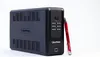 A black CyberPower uninterruptible power supply (UPS) unit is shown against a white background, with a red pen leaning against its right side. Podgląd zdjęcia produktu