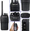 Collage of close-up and full shots of a black Retevis RT21 walkie-talkie, including one shot of it being held in a hand. Produktbild-Vorschau