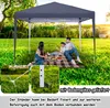 A family having a picnic under a dark gray pop-up gazebo in a grassy park. Produktbild-Vorschau