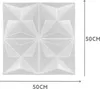 A white 3D wall panel with geometric patterns, shown with dimensions indicated by arrows and text. Produktbild-Vorschau