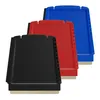 Three ice scrapers of different colors (black, red, blue) are arranged diagonally on a white background. Anteprima dell’immagine prodotto