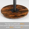 Close-up of the base of a TV stand with a wooden finish and a black metal pole. Anteprima dell’immagine prodotto