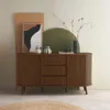 A wooden buffet with decorative items on top, set against a wall with geometric shapes. Anteprima dell’immagine prodotto