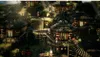 A stylized village scene with thatched-roof huts on a hillside, featuring small figures. Produktbild-Vorschau