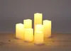 A set of LED candles on a wooden surface against a gray background. Produktbild-Vorschau