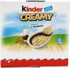 The image shows the packaging of Kinder Creamy, Milky & Crunchy cereal with a depiction of the product and its ingredients. Voir les images du produit