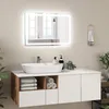 A modern bathroom vanity with a sink and a lit mirror. Náhled obrázku produktu