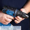 A person is holding a cordless drill. Produktbild-Vorschau