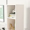 A close-up view of a white bookshelf with books and decorative items on it. Podgląd zdjęcia produktu