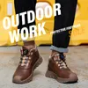 A person wearing work boots in an outdoor setting. Produktbild-Vorschau