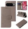 A collage of images showing a grey flip phone case with floral and butterfly embossing, displaying its features and different angles. Produktbild-Vorschau