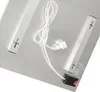 A close-up view of two white heating elements with plus and minus symbols, connected by a white wire to a small black box. Produktbild-Vorschau