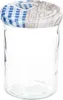 A clear glass jar with a decorative lid. Voir les images du produit