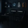 A dark gaming setup with a desk, monitors, and chair. Produktbild-Vorschau