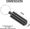 A black pill container with a keychain, with dimensions indicated by text and lines. Produktbild-Vorschau