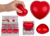 A collage of images showing red heart-shaped stress balls, with one being squeezed by a hand, and others displayed in packaging and as individual items. Náhled obrázku produktu