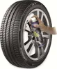 A hand is spraying a tire with a can of tire sealant. Produktbild-Vorschau