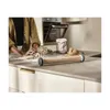 A person is kneading dough on a kitchen counter with a rolling pin in the foreground. Produktbild-Vorschau