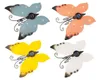 Four solar-powered butterfly lights in different colors arranged in a grid. Podgląd zdjęcia produktu