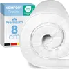 A rolled-up white mattress topper is shown next to its packaging. Produktbild-Vorschau