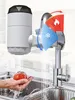 A kitchen sink with a faucet and a water filter attachment, showing water being dispensed and a hand holding a tomato under the water. Produktbild-Vorschau