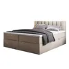 A beige upholstered box spring bed with a headboard, mattress, and pillows, set against a white background. Produktbild-Vorschau