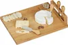 A wooden cheese board with various cheeses, crackers, nuts, and cheese knives. Náhľad obrázku produktu
