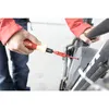 A person is using a screwdriver on a bicycle battery. Náhľad obrázku produktu