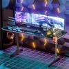 A futuristic gaming setup with multiple monitors, a gaming desk, and RGB lighting.