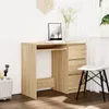 A light oak desk with a keyboard tray and drawers, set against a white wall with a window and curtains in the background. A chair is placed next to the desk. Produktbild-Vorschau