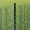 A close-up of a green metal fence post with mesh fencing attached, set against a blurred green grassy background. Produktbild-Vorschau