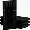 A stack of black acoustic panels with a glossy black panel in the foreground. Podgląd zdjęcia produktu