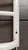 A close-up of a white electric towel radiator's control panel. Náhľad obrázku produktu